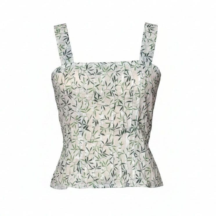 Green leaf patterned top on a white background