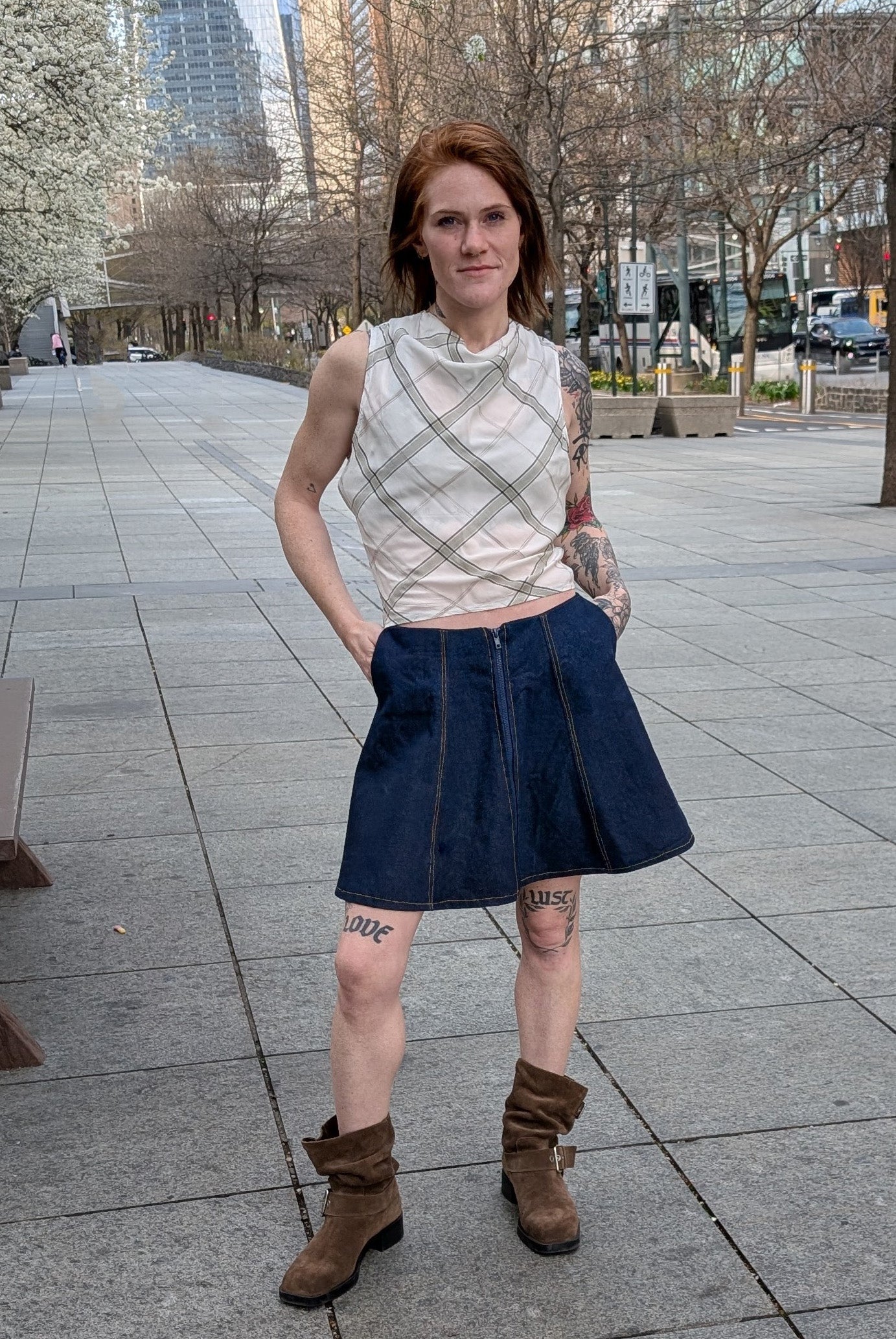 Elle plaid top with denim mini A skirt on model 