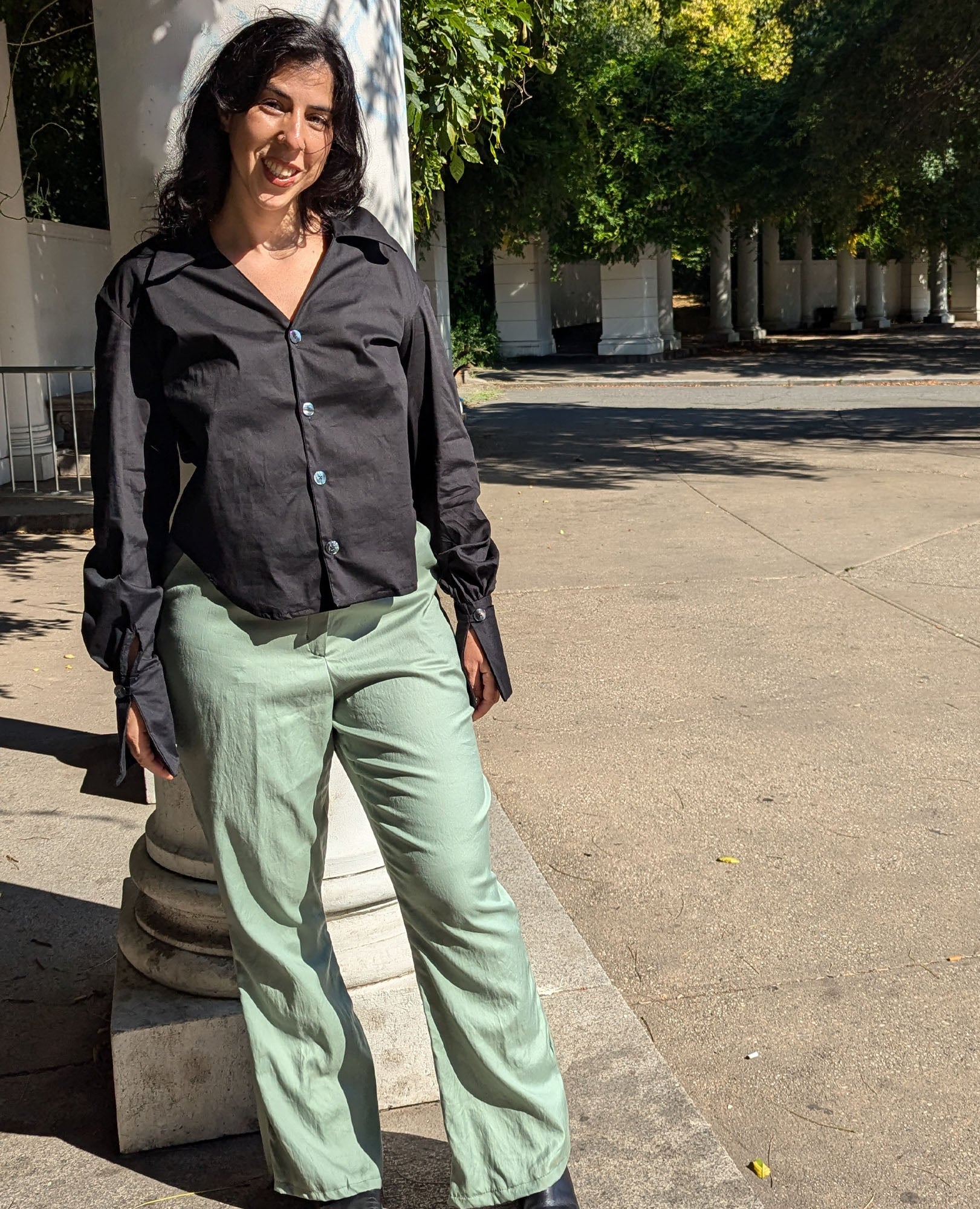 heidi black vintage style button down shirt  with smoke green pants on body 